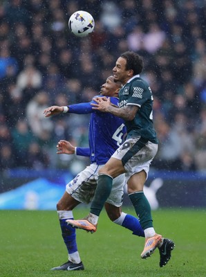 210226 - Plymouth Argyle v Cardiff City - Sky Bet League 1 - Gabriel Osho of Cardiff City holds off Matthew Sorinola of Plymouth Argyle