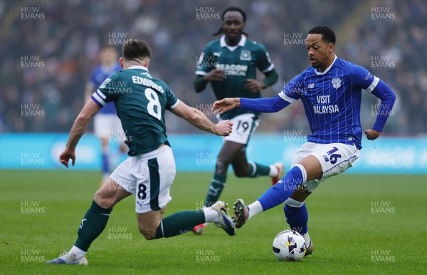 210226 - Plymouth Argyle v Cardiff City - Sky Bet League 1 - Chris Willock of Cardiff City on the break, beating Joe Edwards of Plymouth Argyle