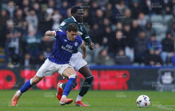 210226 - Plymouth Argyle v Cardiff City - Sky Bet League 1 - Alex Robertson of Cardiff City battles for the ball with Brendan Wiredu of Plymouth Argyle