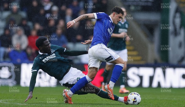 210226 - Plymouth Argyle v Cardiff City - Sky Bet League 1 - Alex Robertson of Cardiff City battles for the ball with Brendan Wiredu of Plymouth Argyle