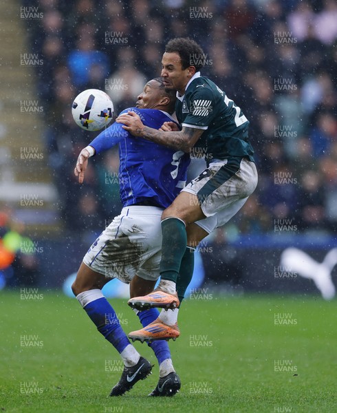 210226 - Plymouth Argyle v Cardiff City - Sky Bet League 1 - Gabriel Osho of Cardiff City holds off Matthew Sorinola of Plymouth Argyle
