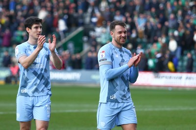 220225 - Plymouth Argyle v Cardiff City - Sky Bet Championship - Callum O Dowda(L) and Aaron Ramsey of Cardiff City applauds the travelling fans at the end of the game