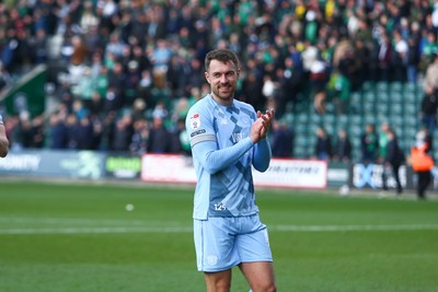 220225 - Plymouth Argyle v Cardiff City - Sky Bet Championship - Aaron Ramsey of Cardiff City applauds the travelling fans at the end of the game