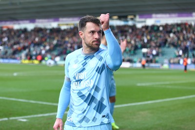 220225 - Plymouth Argyle v Cardiff City - Sky Bet Championship - Aaron Ramsey of Cardiff City applauds the travelling fans at the end of the game