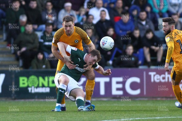 010220 - Plymouth Argyle v Newport County - EFL SkyBet League 2 - Micky Demetriou of Newport County and Luke Jephcott of Plymouth Argyle tussle for the ball