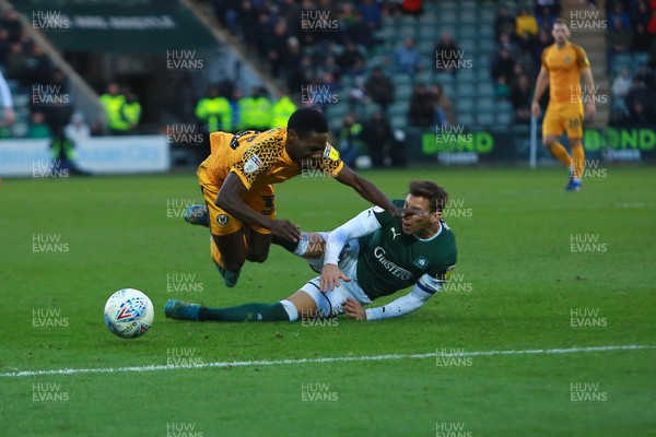 010220 - Plymouth Argyle v Newport County - EFL SkyBet League 2 - Jordan Green of Newport County is tackled by Gary Sawyer of Plymouth Argyle