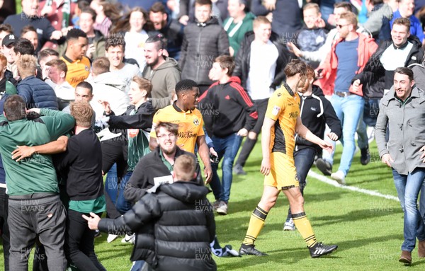 170417 - Plymouth Argyle v Newport County - SkyBet League 2 - Newport County players leave the pitch as fans run onto the pitch at full time