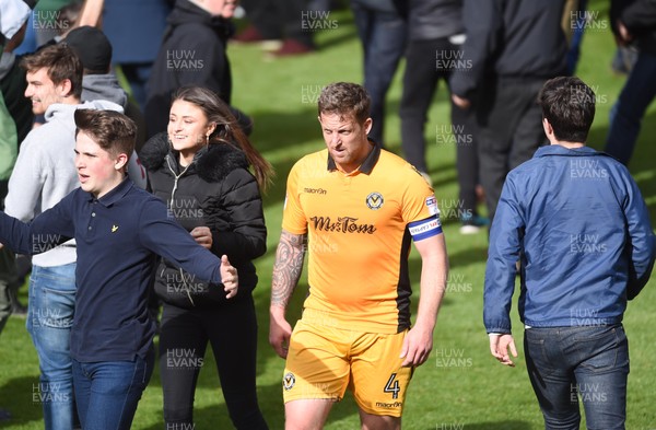 170417 - Plymouth Argyle v Newport County - SkyBet League 2 - Darren Jones of Newport County leaves the pitch as fans run onto the pitch at full time