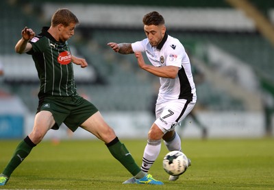 300816 - Plymouth Argyle v Newport County - Checkatrade Trophy -Jack Compton of Newport County is tackled by Nauris Bulvitis of Plymouth Argyle