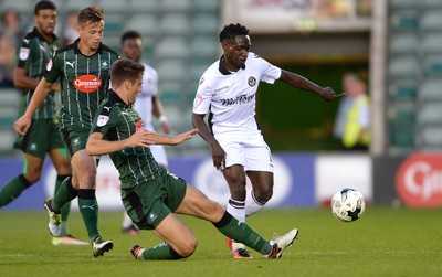 300816 - Plymouth Argyle v Newport County - Checkatrade Trophy -Jordan Green of Newport County is tackled by Ben Purrington of Plymouth Argyle