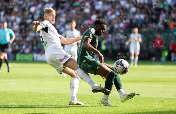071023 - Plymouth Argyle v Swansea City, EFL Sky Bet Championship - Harry Darling of Swansea City and Bali Mumba of Plymouth Argyle compete for the ball