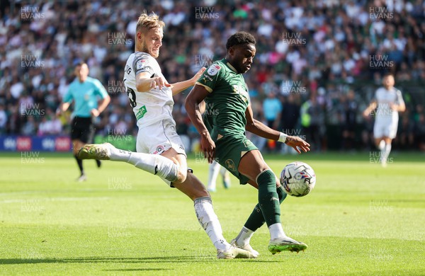 071023 - Plymouth Argyle v Swansea City, EFL Sky Bet Championship - Harry Darling of Swansea City and Bali Mumba of Plymouth Argyle compete for the ball