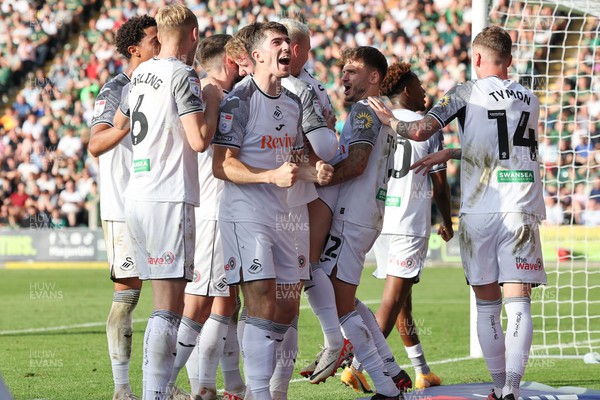 071023 - Plymouth Argyle v Swansea City, EFL Sky Bet Championship - Ollie Cooper of Swansea City is mobbed by team mates after scoring Swansea’s second goal