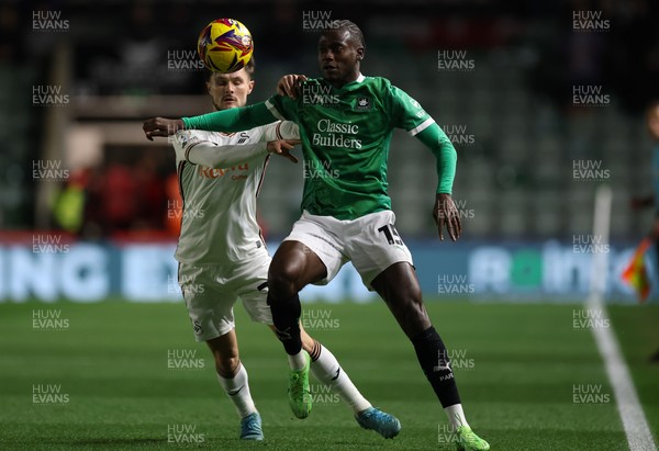 101224 Plymouth Argyle v Swansea City, EFL Sky Bet Championship - Mustapha Bundu of Plymouth looks to hold off Liam Cullen of Swansea City