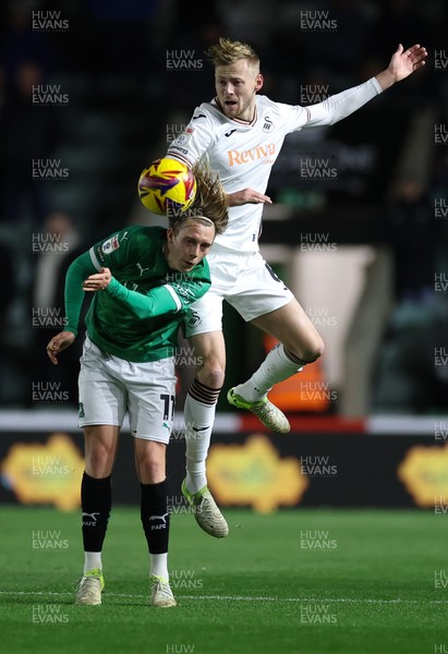 101224 Plymouth Argyle v Swansea City, EFL Sky Bet Championship - Harry Darling of Swansea City and Callum Wright of Plymouth compete for the ball