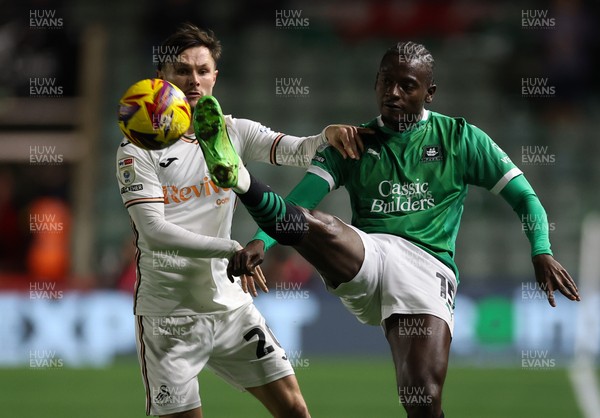 101224 Plymouth Argyle v Swansea City, EFL Sky Bet Championship - Mustapha Bundu of Plymouth looks to hold off Liam Cullen of Swansea City