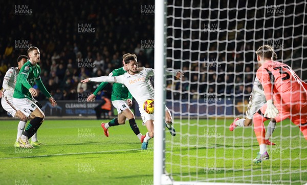 101224 Plymouth Argyle v Swansea City, EFL Sky Bet Championship - Liam Cullen of Swansea City beats Plymouth goalkeeper Daniel Grimshaw to score the second goal