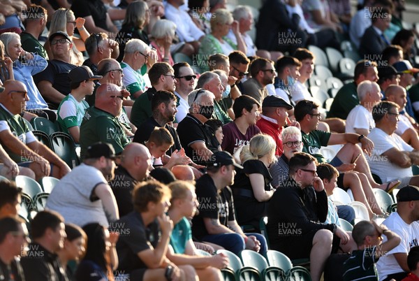 200721 - Plymouth Argyle v Swansea City - Preseason Friendly - A Plymouth Argyle supporter wears a face mask to watch the game as restrictions are eased in England