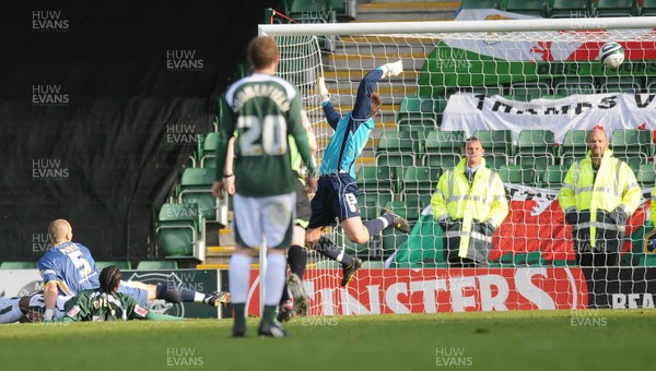 22.11.08 - Championship Football Plymouth Argyle v Cardiff City -  Plymouth's Emile Mpenza (on floor) beats Cardiff 'keeper Thomas Heaton to score goal 