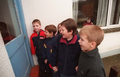 060199 Pontfaen feature - The Children of Llanychllwydog CP School in Pontfaen sing at the doors of the neighbourhood homes to celebrate their New Year