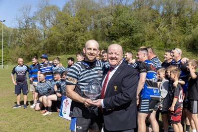 250426 - Pontyberem v Llanybydder - Admiral National League 4 West A - Pontyberem captain Tom Lloyd receives the trophy from WRU Rep Kevin Lewis 