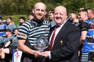 250426 - Pontyberem v Llanybydder - Admiral National League 4 West A - Pontyberem captain Tom Lloyd receives the trophy from WRU Rep Kevin Lewis 