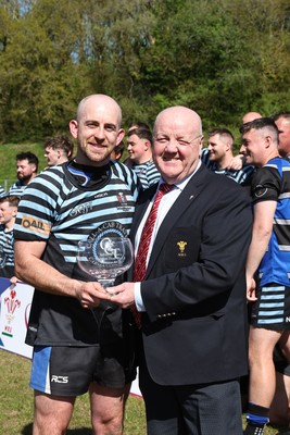 250426 - Pontyberem v Llanybydder - Admiral National League 4 West A - Pontyberem captain Tom Lloyd receives the trophy from WRU Rep Kevin Lewis 