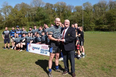 250426 - Pontyberem v Llanybydder - Admiral National League 4 West A - Pontyberem captain Tom Lloyd receives the trophy from WRU Rep Kevin Lewis 