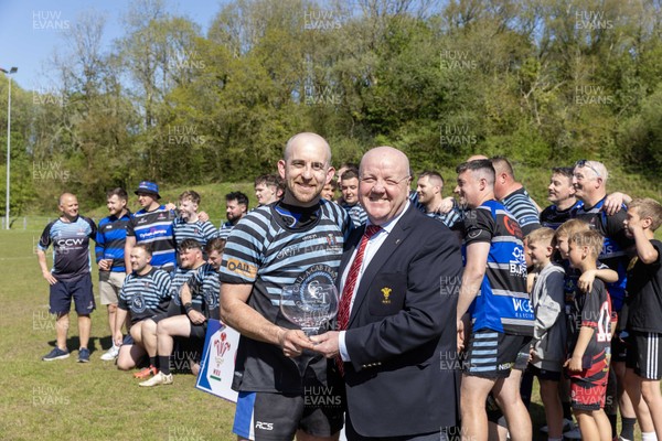 250426 - Pontyberem v Llanybydder - Admiral National League 4 West A - Pontyberem captain Tom Lloyd receives the trophy from WRU Rep Kevin Lewis 