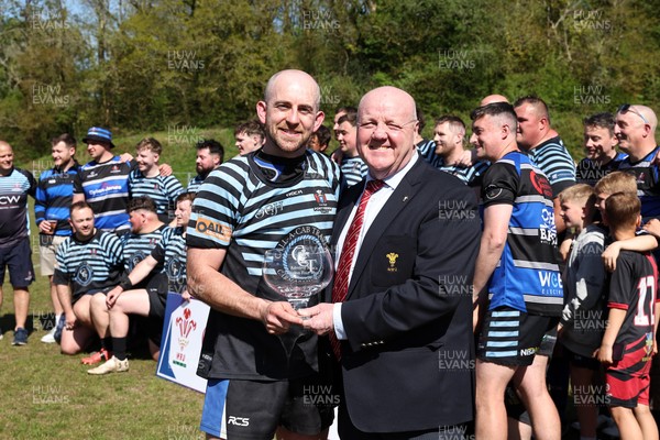 250426 - Pontyberem v Llanybydder - Admiral National League 4 West A - Pontyberem captain Tom Lloyd receives the trophy from WRU Rep Kevin Lewis 
