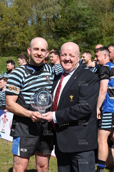250426 - Pontyberem v Llanybydder - Admiral National League 4 West A - Pontyberem captain Tom Lloyd receives the trophy from WRU Rep Kevin Lewis 