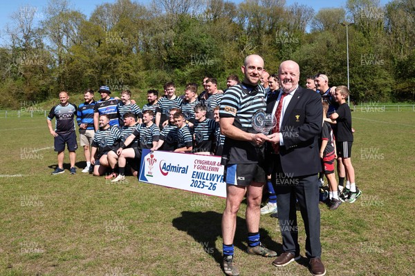 250426 - Pontyberem v Llanybydder - Admiral National League 4 West A - Pontyberem captain Tom Lloyd receives the trophy from WRU Rep Kevin Lewis 