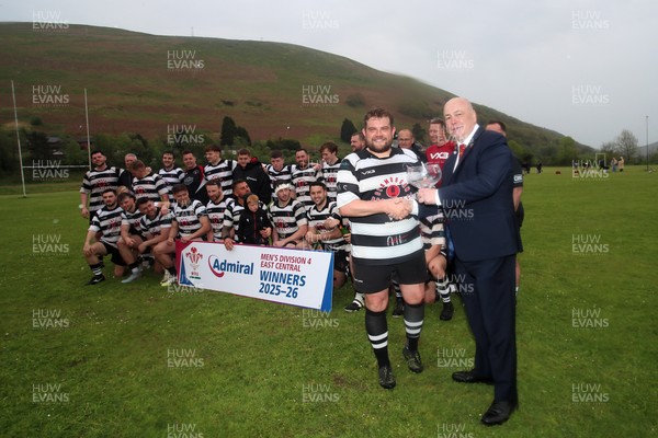 020526 - Ogmore Vale v Pontyclun - Admiral National League 4 East Central - Jo Williams, the captain of Pontyclun RFC is presented with trophy by WRU representative Lloyd Morgan as Pontyclun RFC players celebrate winning the league