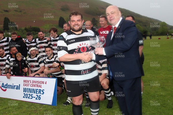 020526 - Ogmore Vale v Pontyclun - Admiral National League 4 East Central - Jo Williams, the captain of Pontyclun RFC is presented with trophy by WRU representative Lloyd Morgan as Pontyclun RFC players celebrate winning the league