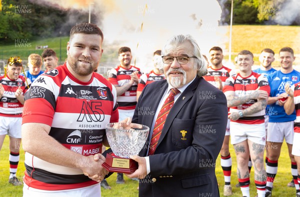 250523 - Pontypool RFC captain Scott Matthews is presented with the Admiral Championship League trophy by WRU board member Bryn Parker