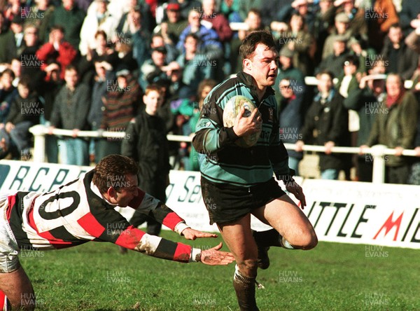 210295 - Pontypool v Cardiff - Simon Hill gets past David Lynch of Pontypool to score a try