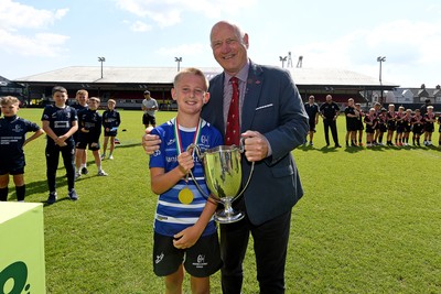 210525 - Pontypridd Schools v Bridgend - WSRU Junior Group - U11’s DC Thomas Cup Final - Boaz Dodge of Bridgend is presented the trophy at full time
