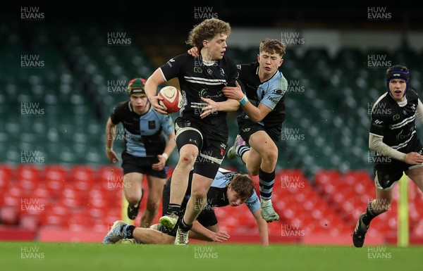 101224 - Pontypridd Schools v Cardiff Central Schools - Dewar Shield - Iestyn Stephens of Pontypridd is tackled by Finley Britton of Cardiff Central  