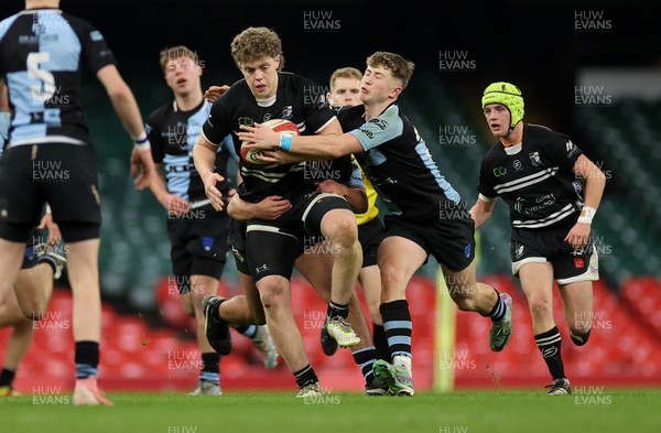 101224 - Pontypridd Schools v Cardiff Central Schools - Dewar Shield - Iestyn Stephens of Pontypridd is tackled by Finley Britton of Cardiff Central  