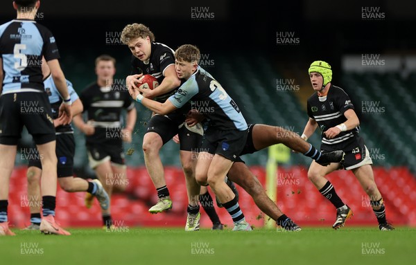 101224 - Pontypridd Schools v Cardiff Central Schools - Dewar Shield - Iestyn Stephens of Pontypridd is tackled by Finley Britton of Cardiff Central  