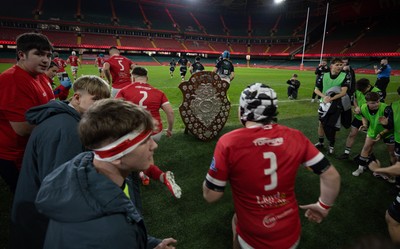 111225 - Pontypridd U16 Schools v Llanelli U16 Schools, Dewar Shield Final - The teams run out past The Dewar Shield at the start of the match