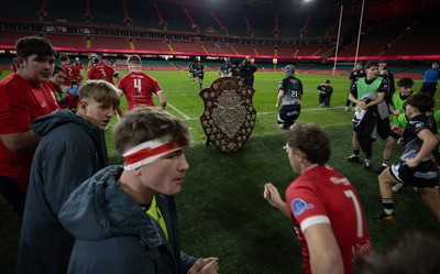 111225 - Pontypridd U16 Schools v Llanelli U16 Schools, Dewar Shield Final - The teams run out past The Dewar Shield at the start of the match