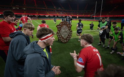 111225 - Pontypridd U16 Schools v Llanelli U16 Schools, Dewar Shield Final - The teams run out past The Dewar Shield at the start of the match