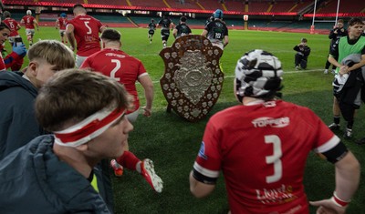 111225 - Pontypridd U16 Schools v Llanelli U16 Schools, Dewar Shield Final - The teams run out past The Dewar Shield at the start of the match