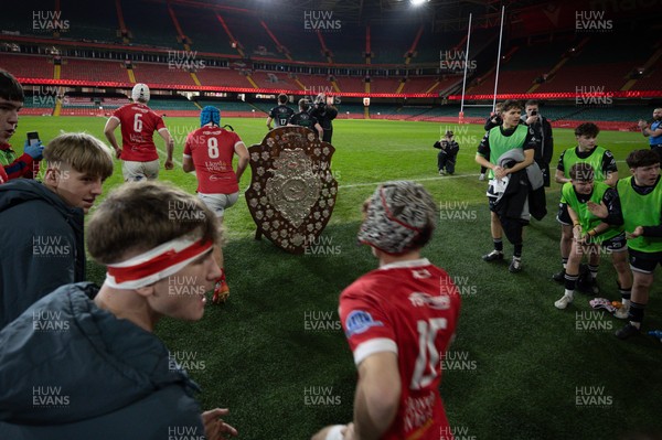 111225 - Pontypridd U16 Schools v Llanelli U16 Schools, Dewar Shield Final - The teams run out past The Dewar Shield at the start of the match