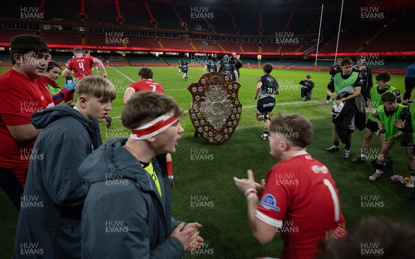 111225 - Pontypridd U16 Schools v Llanelli U16 Schools, Dewar Shield Final - The teams run out past The Dewar Shield at the start of the match