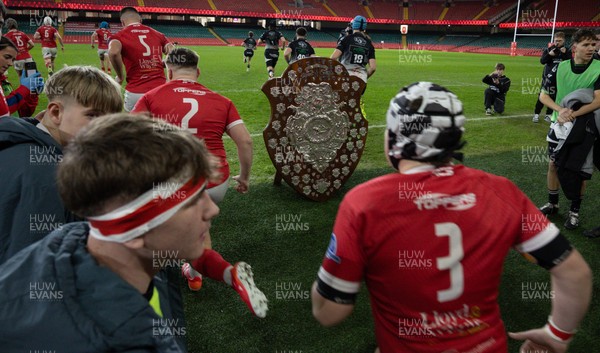111225 - Pontypridd U16 Schools v Llanelli U16 Schools, Dewar Shield Final - The teams run out past The Dewar Shield at the start of the match