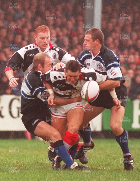 191096 - Pontypridd v Bath - Steele Lewis of Pontypridd is tackled by Andy Robinson