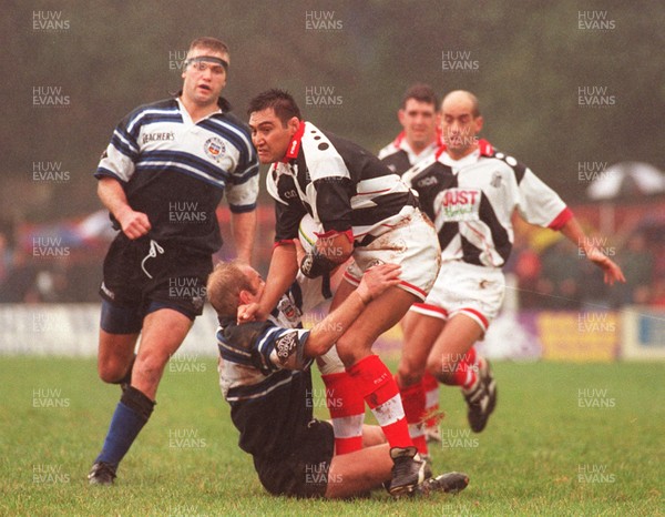 191096 - Pontypridd v Bath - Dale McIntosh of Pontypridd is tackled by Andy Robinson