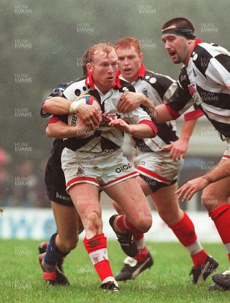 191096 - Pontypridd v Bath - Neil Jenkins of Pontypridd is tackled by Mike Catt